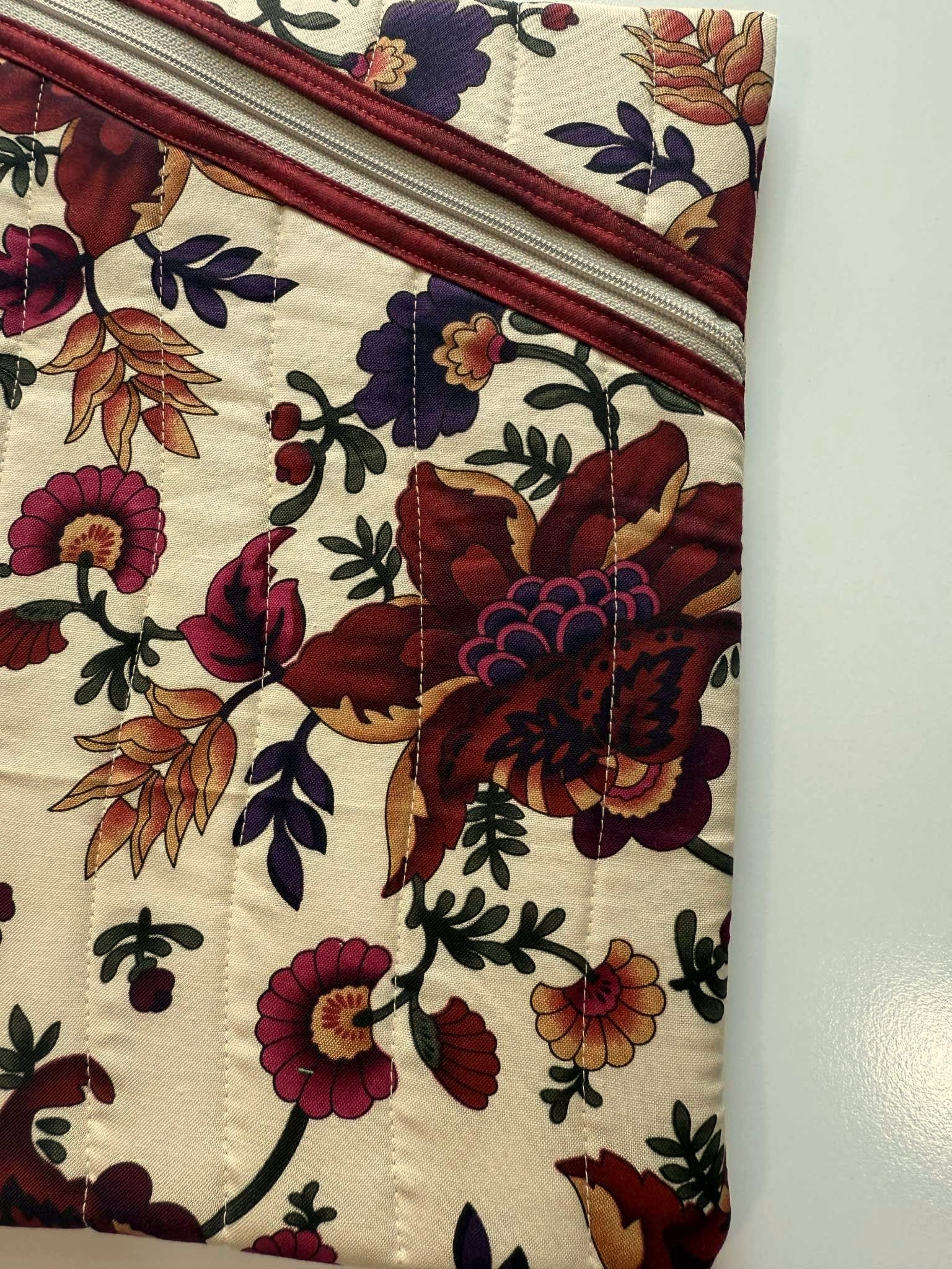 Close-up of diagonal zipper and floral cotton fabric