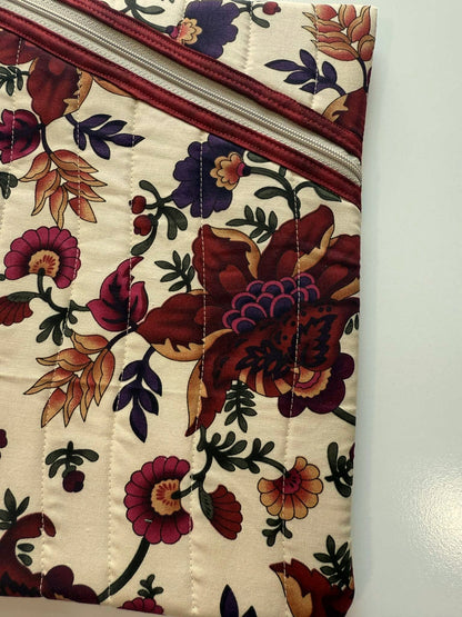 Close-up of diagonal zipper and floral cotton fabric